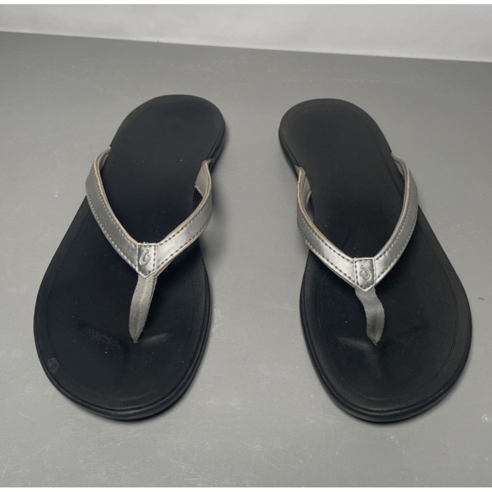 OluKai Black Footbed Flip Flops with Silver Straps